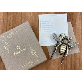 The bee-shaped clip is packaged in a decorative paper box.