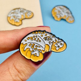 A pin made of tin in the shape of a St. Martin's Croissant.
