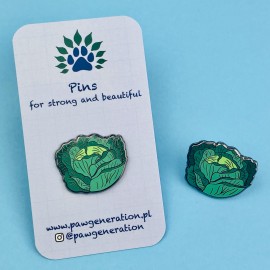 A cabbage-shaped pin made of tin.