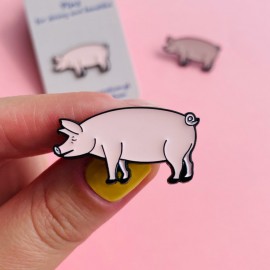 Pig-shaped pin made of pewter.