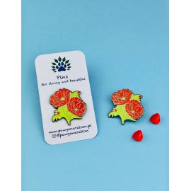 A pin in the shape of poppies made of tin.