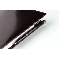 Leather notebook cover with pen holder.